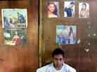 An East Timorese boy poses in front of a An East Timorese boy poses in front of a
